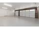 Spacious two-car garage featuring a clean, epoxy floor and ample storage space at 226 W Ranch Rd, Tempe, AZ 85284