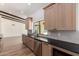 Modern kitchen features stainless appliances, wooden cabinets, and sleek countertops at 226 W Ranch Rd, Tempe, AZ 85284