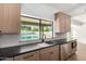 Modern kitchen features stainless appliances, wooden cabinets, and sleek countertops at 226 W Ranch Rd, Tempe, AZ 85284