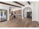 Open-concept living area showcasing hardwood floors and seamless access to other areas at 226 W Ranch Rd, Tempe, AZ 85284
