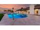 Relaxing pool with baja step surrounded by stone-style deck for leisure and outdoor enjoyment at 226 W Ranch Rd, Tempe, AZ 85284