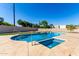 Inviting pool with sparkling water and baja step, with pristine artificial grass and privacy fence at 226 W Ranch Rd, Tempe, AZ 85284