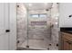 Modern bathroom featuring a glass-enclosed shower with neutral tile and a built-in niche at 226 W Ranch Rd, Tempe, AZ 85284
