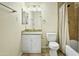 Cozy bathroom featuring a vanity with granite counters, a framed mirror, and a shower with curtain at 23 W Fairmont Dr, Tempe, AZ 85282