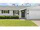 Charming single-story home features a well-manicured lawn, white brick exterior, and black front door at 23 W Fairmont Dr, Tempe, AZ 85282