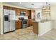 Updated kitchen boasts stainless steel appliances, custom cabinetry, and granite countertops at 23 W Fairmont Dr, Tempe, AZ 85282