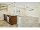 Open kitchen featuring tile floors, wooden cabinets, granite counters, stainless steel dishwasher, and open shelving at 23 W Fairmont Dr, Tempe, AZ 85282