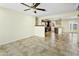 Open concept living and dining area featuring tile flooring, ceiling fan, and kitchen access at 23 W Fairmont Dr, Tempe, AZ 85282