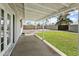 Covered patio area with a view of the spacious backyard and block fence at 23 W Fairmont Dr, Tempe, AZ 85282