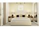 Cozy bedroom with a neutral color scheme, stylish lamps, and modern accents at 23225 W Marguerite Ave, Buckeye, AZ 85326