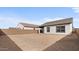 The backyard is enclosed with a block wall and has easy access to the house at 23403 W Albeniz Pl, Buckeye, AZ 85326