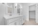 Bright bathroom features double sinks, a large mirror, and a walk-in shower at 23403 W Albeniz Pl, Buckeye, AZ 85326