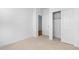 Bedroom featuring carpet, closet, and light-filled doorways at 23403 W Albeniz Pl, Buckeye, AZ 85326