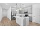 Modern kitchen featuring stainless steel appliances and a center island with pendant lighting at 23403 W Albeniz Pl, Buckeye, AZ 85326