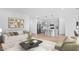 Comfortable living room showcasing an open floor plan with kitchen and dining area at 23403 W Albeniz Pl, Buckeye, AZ 85326