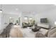 Open-concept living room with modern furnishings, bright and inviting space at 23403 W Albeniz Pl, Buckeye, AZ 85326