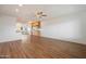 Open-concept kitchen and dining area featuring wood flooring and cabinets at 2436 E Elm St, Phoenix, AZ 85016