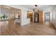 Bright and airy living space with open kitchen featuring wood cabinets, granite counters, and stainless steel appliances at 2436 E Elm St, Phoenix, AZ 85016
