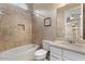 Updated bathroom featuring a shower over tub combination with tile surround and vanity at 2926 E Minnezona Ave, Phoenix, AZ 85016