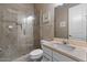 Bright bathroom with a glass shower and a light-colored vanity at 2926 E Minnezona Ave, Phoenix, AZ 85016