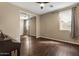 Bright bedroom featuring a ceiling fan, closet with mirrored doors and wood look floors at 2926 E Minnezona Ave, Phoenix, AZ 85016