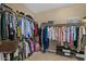 Spacious walk-in closet with ample storage and shelving, providing organization and convenience at 2926 E Minnezona Ave, Phoenix, AZ 85016