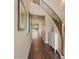 Foyer showcasing wood floors, staircase, and views into the living room at 2926 E Minnezona Ave, Phoenix, AZ 85016