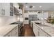 Bright kitchen featuring granite countertops, a gas cooktop, and white cabinets at 2926 E Minnezona Ave, Phoenix, AZ 85016
