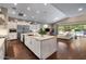 Open concept kitchen with granite countertops, stainless steel appliances, and dark hardwood floors at 2926 E Minnezona Ave, Phoenix, AZ 85016