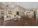 Bright and airy living room featuring an open layout, wood floors, and seamless flow to the kitchen at 2926 E Minnezona Ave, Phoenix, AZ 85016