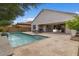 Inviting backyard pool with tanning shelf and direct access to the home's interior through large sliding doors at 2926 E Minnezona Ave, Phoenix, AZ 85016