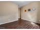 A room with wood look floors and neutral walls providing a blank canvas for personalization at 2926 E Minnezona Ave, Phoenix, AZ 85016