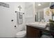 This well-maintained bathroom has a single sink vanity with black countertops and stylish decorations at 3104 E Broadway Rd # 170, Mesa, AZ 85204
