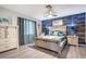Stylishly furnished bedroom with ceiling fan, wood paneling and well-coordinated decor at 3104 E Broadway Rd # 170, Mesa, AZ 85204