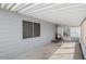 Attached carport offering shade and protection with a view of the home's exterior at 3104 E Broadway Rd # 170, Mesa, AZ 85204