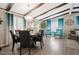 Inviting dining area with a round table, stylish chairs, and elegant chandelier at 3104 E Broadway Rd # 170, Mesa, AZ 85204