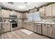 Well-equipped kitchen with stainless steel appliances and updated countertops at 3104 E Broadway Rd # 170, Mesa, AZ 85204