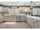 Spacious kitchen boasts modern appliances, wood paneling, ample counter space and a stylish color palette at 3104 E Broadway Rd # 170, Mesa, AZ 85204