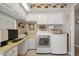 A laundry area with ample storage, counter space, and modern washer and dryer units at 3104 E Broadway Rd # 170, Mesa, AZ 85204