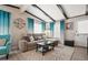 Comfortable living room with stylish decor, wood-look floors, and ample natural light at 3104 E Broadway Rd # 170, Mesa, AZ 85204