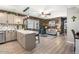 Open concept living space with a modern kitchen and cozy seating area at 3104 E Broadway Rd # 170, Mesa, AZ 85204