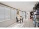 Enclosed sunroom showcasing a patio area with table and chairs, and lots of natural light, perfect for relaxation at 3104 E Broadway Rd # 170, Mesa, AZ 85204
