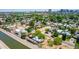 Neighborhood aerial showcasing various home styles, lush landscaping, and the canal at 330 W Minnezona Ave, Phoenix, AZ 85013