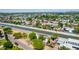 The canal flows through a neighborhood with diverse architectural styles and lush greenery at 330 W Minnezona Ave, Phoenix, AZ 85013