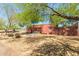Expansive backyard featuring mature trees, providing ample shade and privacy to the home at 330 W Minnezona Ave, Phoenix, AZ 85013