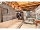 Unfinished basement featuring exposed beams, a claw foot tub and metal accents at 330 W Minnezona Ave, Phoenix, AZ 85013