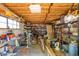 Basement storage area filled with various items, shelving, tools, and vintage equipment at 330 W Minnezona Ave, Phoenix, AZ 85013