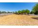 A spacious, sun-drenched front yard shows the potential for landscaping at 330 W Minnezona Ave, Phoenix, AZ 85013