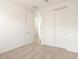 Bedroom with carpet flooring, large closet, and a hallway entrance at 35459 N Seedling St, San Tan Valley, AZ 85144