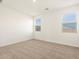 Bedroom featuring neutral carpet, light walls, and plenty of natural light at 35459 N Seedling St, San Tan Valley, AZ 85144